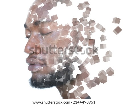 Multiple cubes floating in the air combined with a portrait of a young man