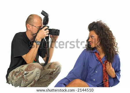 Professional photographer with dSLR while working with beautiful female model in studio isolated on white background / the beauty & the beast!