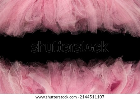 Pink tule tutu fabric used for graphic border frames Royalty-Free Stock Photo #2144511107