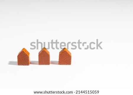 Real Estate - Wooden houses isolated on white backgroung