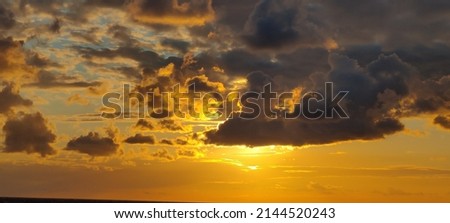 Sunset sea clouds sunlight sun waves beach people scene view family summer sky background holiday vacation landscape natural beautiful horizon