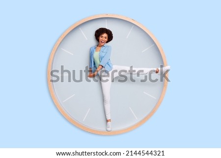 Photo image of funny lady stuck inside huge large clock use her legs instead of arrows have fun concept of time arrangement every second have cost