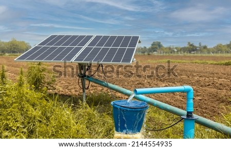 Water pumps and solar panels in farm. Royalty-Free Stock Photo #2144554935