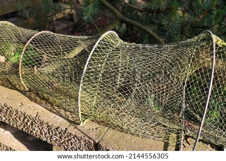 Traditional weathered fish-trap drying in the sun Royalty-Free Stock Photo #2144556305