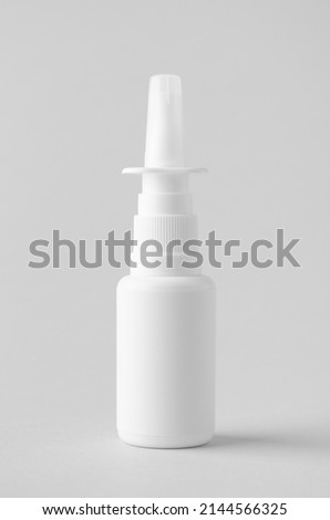 Nasal spray mockup. White plastic bottle with blank label. Royalty-Free Stock Photo #2144566325
