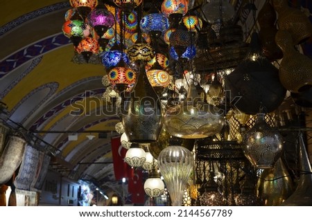 Grand bazaar Istanbul bright vivid lamps people trade oriental arabic background hops stores market supermarket decoration Turkeymulticolored chandeliers pendants lustres lampshades