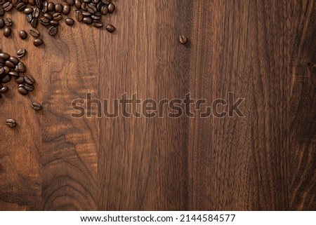 Coffee beans on walnut table