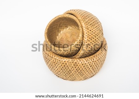 Wickerwork made of bamboo is a functional item to put things. Royalty-Free Stock Photo #2144624691