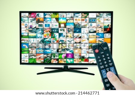 Widescreen high definition TV screen with video gallery. Remote control in hand