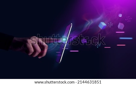 Metaverse and Blockchain Technology Concepts. Person with an Experiences of Metaverse Virtual World via Smart Phone. Futuristic Tone. Conceptual Photo Royalty-Free Stock Photo #2144631851