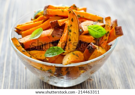 Sweet potato in a bowl on wooden background