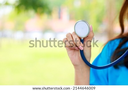 Concept of medical services in hospitals. Patient care. doctor wearing surgical gown holding a stethoscope to examine the patient. copy space