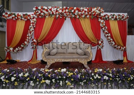 indian wedding stage decoration with flower arrangements Royalty-Free Stock Photo #2144683315