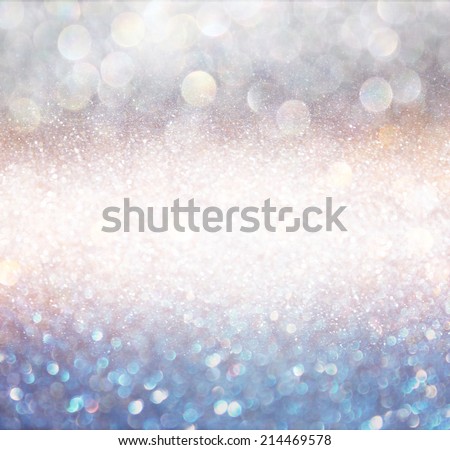 bokeh lights background with multi layers colors of white silver and blue