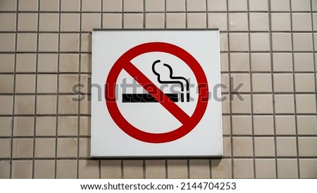 No Smoke Sign On A Wall                        