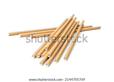 Paper drink straw isolated. Brown disposable drinking straws, eco-friendly cocktail tubes, zero waste pipe on white background Royalty-Free Stock Photo #2144705769