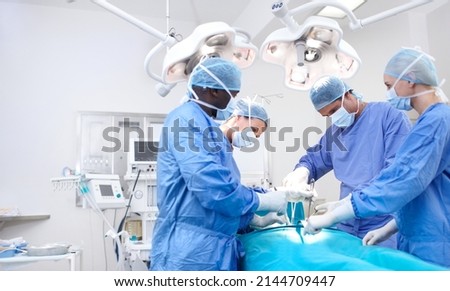 Let your copyspace tell families the good news. Meidcal surgeons performing surgery in an operating theatre together - Copyspace. Royalty-Free Stock Photo #2144709447