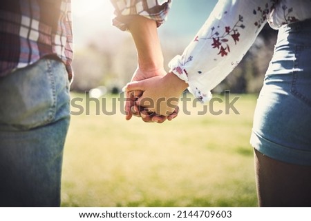 I want you by my side forever. Cropped shot of an unrecognizable couple holding hands outdoors. Royalty-Free Stock Photo #2144709603