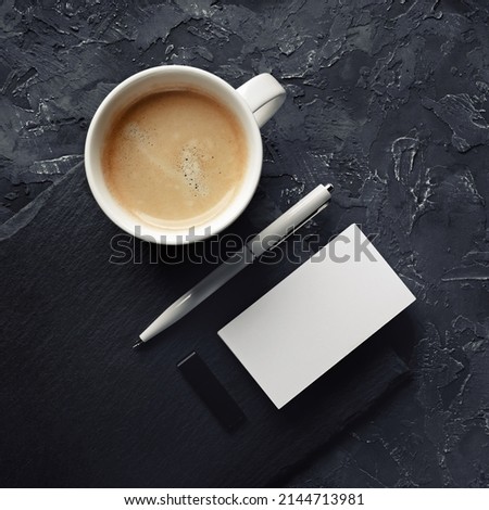 Blank business card, coffee cup, pen, usb flash drive. Template for placing your design. Top view.