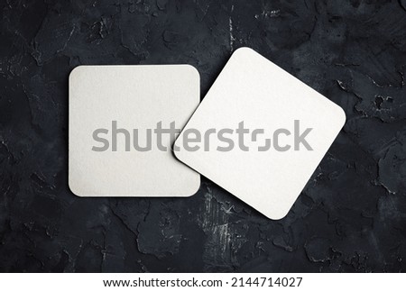 Two blank square beer coasters. Responsive design template. Top view. Royalty-Free Stock Photo #2144714027
