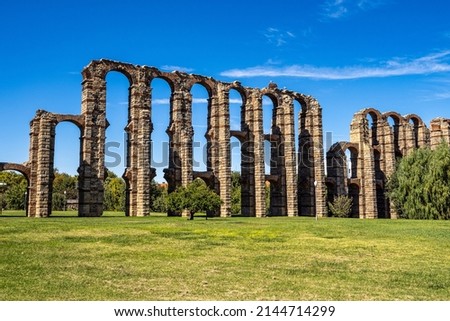 The Acueducto de los Milagros, Miraculous Aqueduct in Merida, Extremadura, Spain is a ruined Roman aqueduct bridge, part of the aqueduct built to supply water to the Roman colony of Emerita Augusta Royalty-Free Stock Photo #2144714299