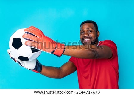 happiness brazilian player man over isolated blue background