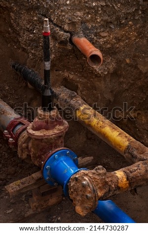Water  pipes  in a trench at a construction site. Close-up.