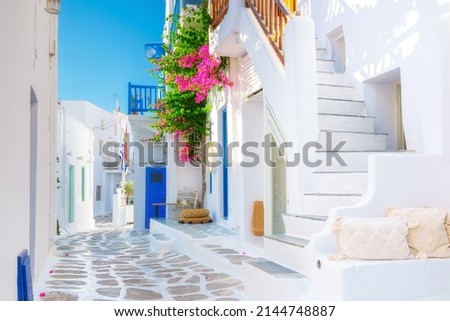 The island of Mykonos, Greece. Streets and traditional architecture. White-colored buildings and bright flowers. Travel photography. Royalty-Free Stock Photo #2144748887