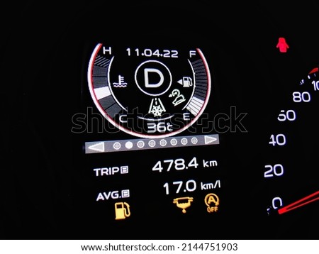 Drive 478.4 kilometers, use 17 kilometers per liter of petrol.  fuel-efficient driving concept. Royalty-Free Stock Photo #2144751903