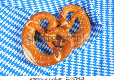 Salty bavarian pretzels on checkered Background 
