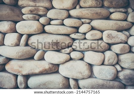 3D stone wall with round pebble stones