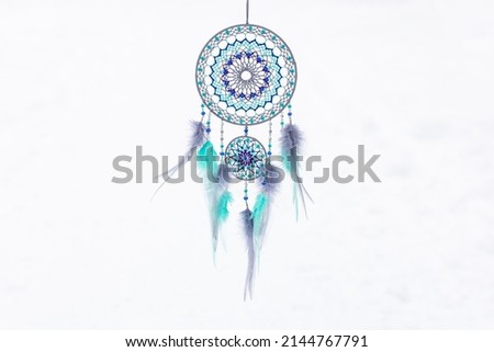 Dream catcher with feathers threads and beads rope hanging. Dreamcatcher handmade Royalty-Free Stock Photo #2144767791