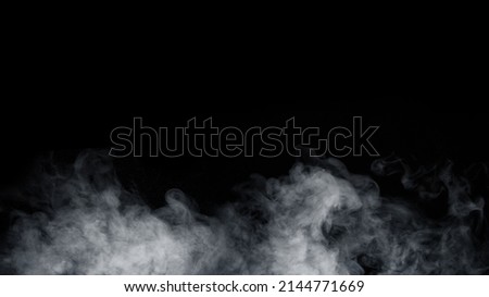 Panoramic view of the abstract fog. White cloudiness, mist or smog moves on black background. Beautiful swirling gray smoke. Mockup for your logo. Royalty-Free Stock Photo #2144771669
