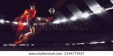Forward. Bright dynamic collage with professional soccer, football player kick the ball in jump at dark night stadium with flashlights. Sport, competition, championship. Action, motion, active