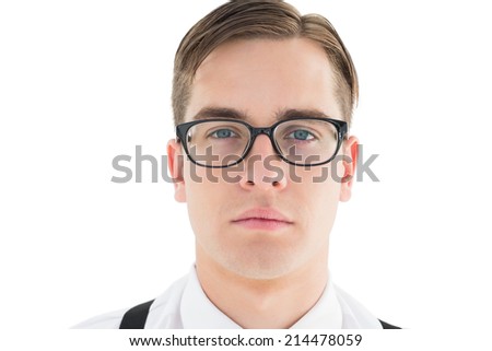Nerdy hipster looking at camera on white background