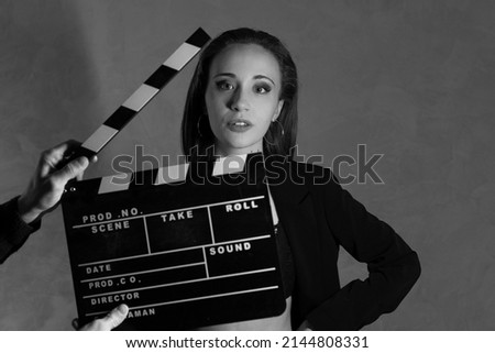 Actress ready for the ciak cinema scene during the production of short film in the night. Woman, girl, inside a black and white movie set before the ciak