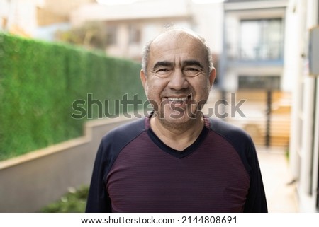Happy and tired middle eastern man looking at the camera selective focus outdoor real people portrait Royalty-Free Stock Photo #2144808691