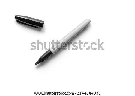 Black Permanent Marker Laying Flat Isolated Against White Background with Cap Off Royalty-Free Stock Photo #2144844033