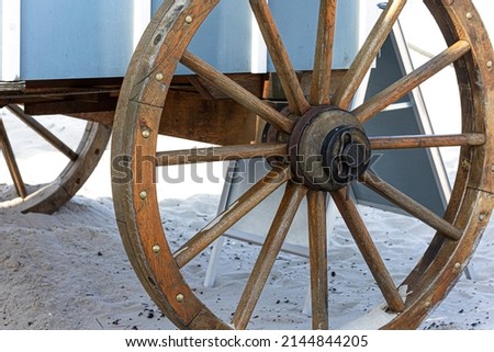 Closeup image of a vintage carriage wheel.