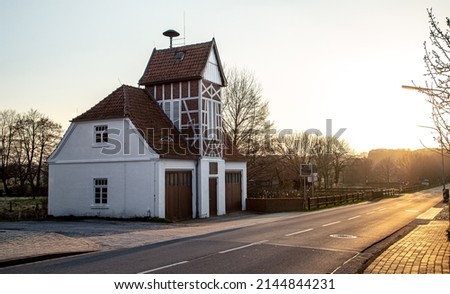 Beautiful old German house by the road at sunset.