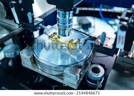 Manufacture of microprocessors. Creation of microchips. Equipment for production of nano processors. Creation and testing of electronic chip under microscope. Chip testing equipment. Royalty-Free Stock Photo #2144848671