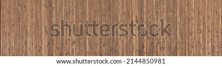 Wooden decorative carved building facade or fence, wooden planks. Pattern or texture Royalty-Free Stock Photo #2144850981