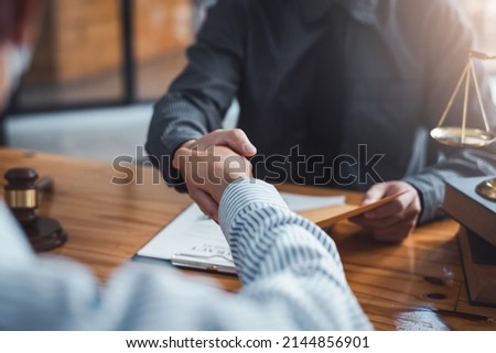 Businessman handshake partner lawyers or attorneys discussing a contract agreement. Business people shaking hands to congratulate success. Royalty-Free Stock Photo #2144856901