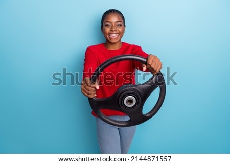 Photo of cool young brunette lady drive car wear red shirt isolated on blue color background