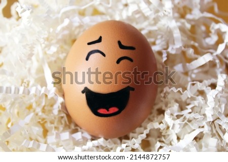 Smiling Easter egg in a designed nest