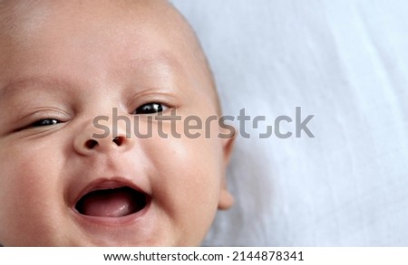 baby looking with big eyes just after having a good sleep in bed stock photos  