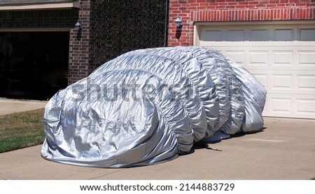  Parked car hail blanket covered protection.                               Royalty-Free Stock Photo #2144883729