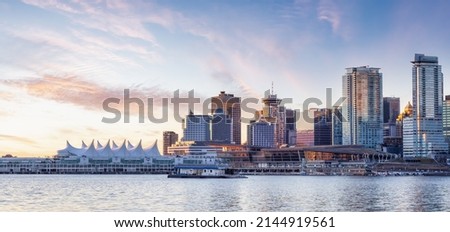 Panoramic View of Modern City Building Skyline on West Coast Pacific Ocean. Dramatic Sunrise Sky Art Render. Stanley Park, Coal Harbour, Downtown Vancouver, British Columbia, Canada. Royalty-Free Stock Photo #2144919561