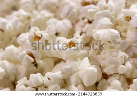 Scattered popcorn. Close-up picture of fluffy salted popcorn. background texture.