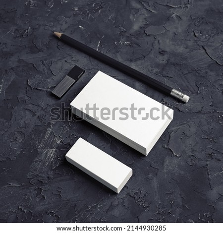 Photo of business cards, pencil, eraser and usb flash drive. Branding mock up.